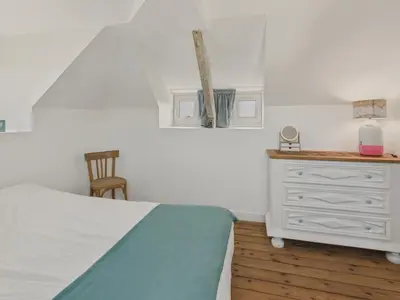 Un ou plusieurs lits dans un hébergement de l'établissement Maison avec jardin pour 4 adultes et 2 enfants