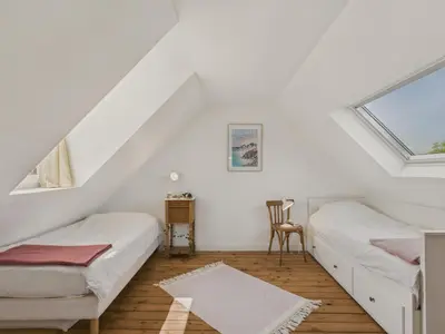 Un ou plusieurs lits dans un hébergement de l'établissement Maison avec jardin pour 4 adultes et 2 enfants