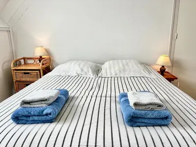 Un ou plusieurs lits dans un hébergement de l'établissement Maison de Charme