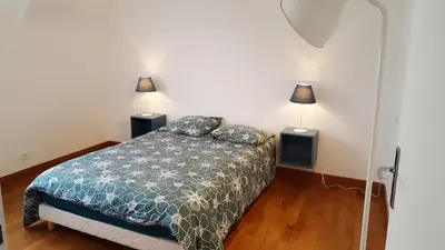 Un ou plusieurs lits dans un hébergement de l'établissement Apartment close tonte sea