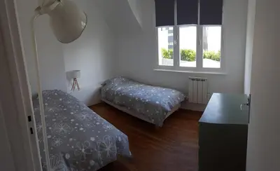Un ou plusieurs lits dans un hébergement de l'établissement Apartment close tonte sea