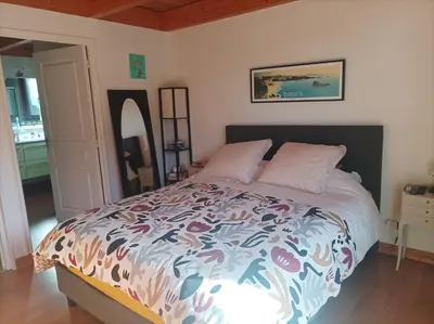 Un ou plusieurs lits dans un hébergement de l'établissement Maison très confortable et douillette