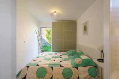 Un ou plusieurs lits dans un hébergement de l'établissement Ty Koad - maison avec grande terrasse