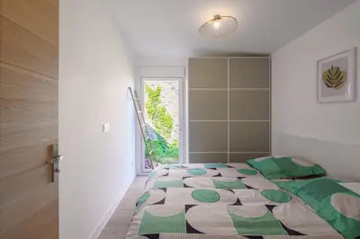 Un ou plusieurs lits dans un hébergement de l'établissement Ty Koad - maison avec grande terrasse