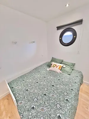 Un ou plusieurs lits dans un hébergement de l'établissement Appartement Cosy 600m de la plage
