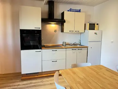 Cuisine ou kitchenette dans l'établissement Appartement Cosy 600m de la plage