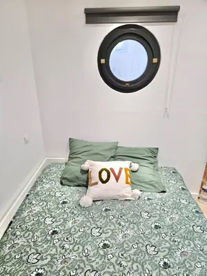 Un ou plusieurs lits dans un hébergement de l'établissement Appartement Cosy 600m de la plage