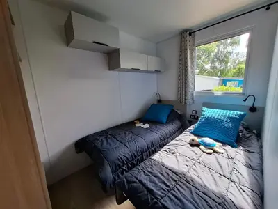 Un ou plusieurs lits dans un hébergement de l'établissement Camping de La Piscine