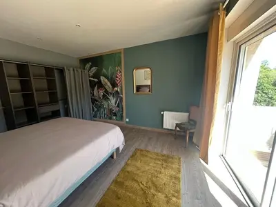 Un ou plusieurs lits dans un hébergement de l'établissement Appartement dans un moulin avec terrasse