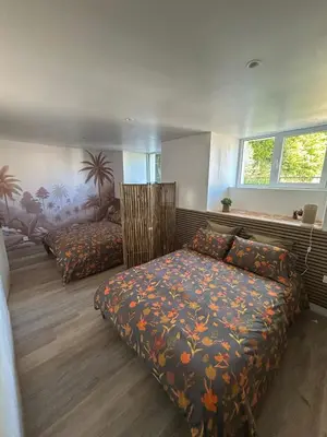 Un ou plusieurs lits dans un hébergement de l'établissement Appartement dans un moulin avec terrasse