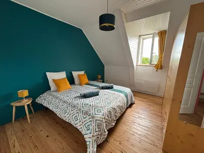 Un ou plusieurs lits dans un hébergement de l'établissement Bel appartement avec jardin à la campagne