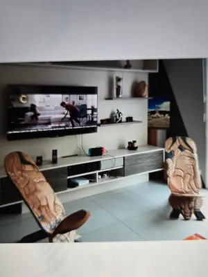 Télévision ou salle de divertissement dans l'établissement Maison familiale