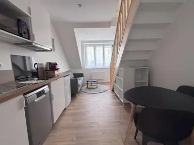Cuisine ou kitchenette dans l'établissement Logements centre Bourg