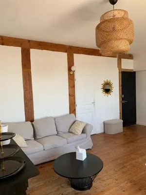 Coin salon dans l'établissement Appartement ville mer
