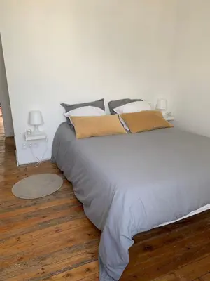 Un ou plusieurs lits dans un hébergement de l'établissement Appartement ville mer
