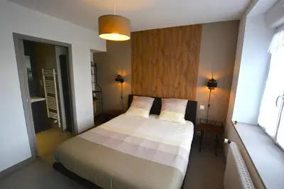 Un ou plusieurs lits dans un hébergement de l'établissement IROISE GRANDE MAISON en Baie d'Audierne Finistère 5 chambres