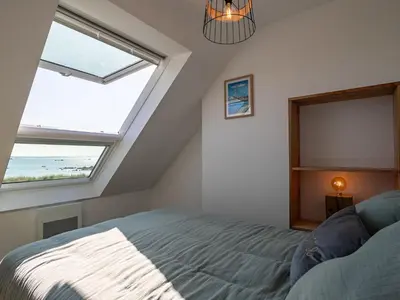 Un ou plusieurs lits dans un hébergement de l'établissement Holiday Home Les reflets bleus by Interhome
