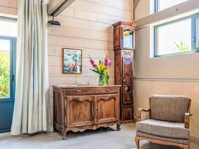 Coin salon dans l'établissement Holiday Home Le Préau by Interhome
