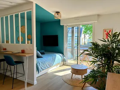 Télévision ou salle de divertissement dans l'établissement Studio cosy la plage à pieds