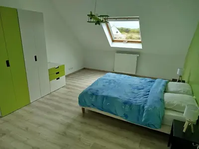 Un ou plusieurs lits dans un hébergement de l'établissement Grande maison familiale