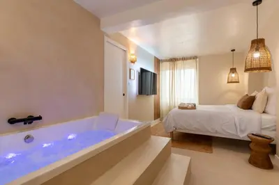Un ou plusieurs lits dans un hébergement de l'établissement Suite Baniléa & Spa