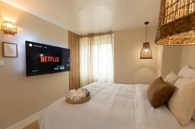 Un ou plusieurs lits dans un hébergement de l'établissement Suite Baniléa & Spa