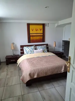 Un ou plusieurs lits dans un hébergement de l'établissement Appartements rénové a neuf au rez de chaussé de notre maison
