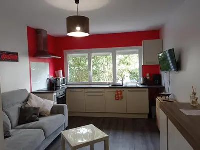 Télévision ou salle de divertissement dans l'établissement Beau studio rez de chaussée