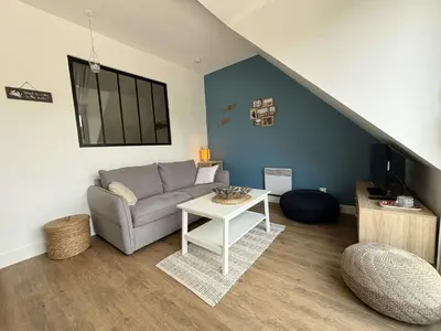 Coin salon dans l'établissement Appartement cosy pour 4 personnes au cœur de la Forêt-Fouesnant - FR-1-481-179