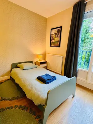 Un ou plusieurs lits dans un hébergement de l'établissement King Size XXL - calme & confort en plein Quimper