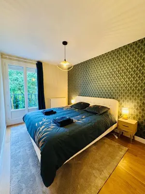 Un ou plusieurs lits dans un hébergement de l'établissement King Size XXL - calme & confort en plein Quimper