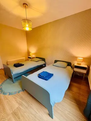 Un ou plusieurs lits dans un hébergement de l'établissement King Size XXL - calme & confort en plein Quimper