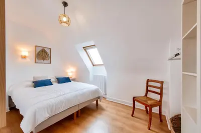 Un ou plusieurs lits dans un hébergement de l'établissement Vue mer - Maison pour 8 - Grand jardin