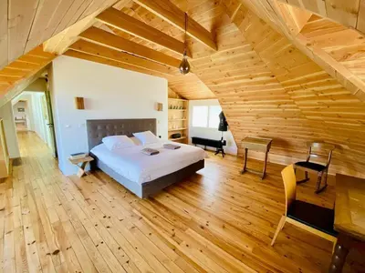 Un ou plusieurs lits dans un hébergement de l'établissement Villa le 25 - Piscine et Sauna au bourg de Carantec