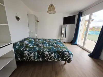 Un ou plusieurs lits dans un hébergement de l'établissement Jolie maison neuve proche plages GR34 et port de Aber Wrach