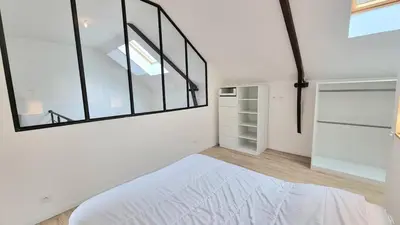 Un ou plusieurs lits dans un hébergement de l'établissement Avelenn Belle maison de ville avec terrasse