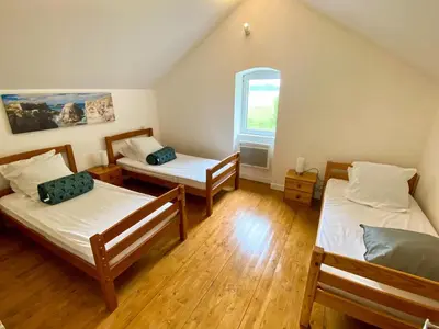 Un ou plusieurs lits dans un hébergement de l'établissement Charmante Maison au fil de la Voie Verte