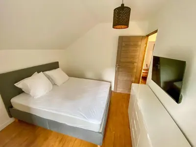 Un ou plusieurs lits dans un hébergement de l'établissement Charmante Maison au fil de la Voie Verte