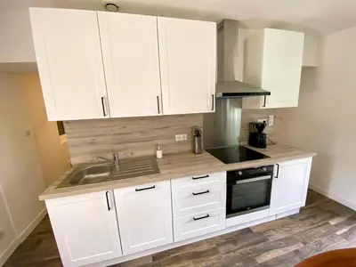 Cuisine ou kitchenette dans l'établissement Charmante Maison au fil de la Voie Verte