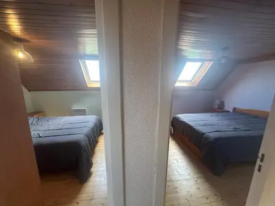Un ou plusieurs lits dans un hébergement de l'établissement Maison de vacances Crozon 2ch - jardin clos