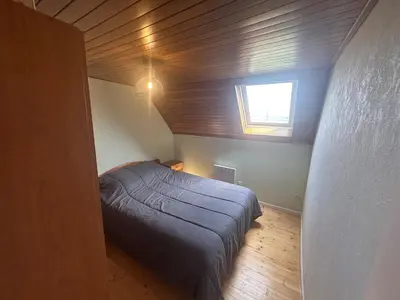 Un ou plusieurs lits dans un hébergement de l'établissement Maison de vacances Crozon 2ch - jardin clos