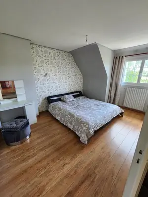 Un ou plusieurs lits dans un hébergement de l'établissement Maison avec Jardin et Jacuzzi