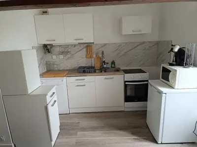 Cuisine ou kitchenette dans l'établissement Charmant appartement proche de la ville et du bord de Mer