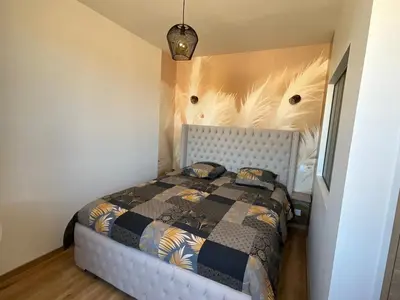 Un ou plusieurs lits dans un hébergement de l'établissement Appartement à 10 minutes à pied de la mer