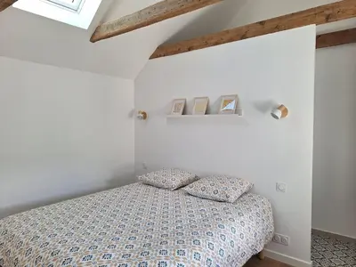 Un ou plusieurs lits dans un hébergement de l'établissement Maison de vacances à 10 minutes des plages de Porspoder