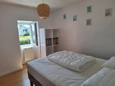 Un ou plusieurs lits dans un hébergement de l'établissement Maison de vacances à 10 minutes des plages de Porspoder