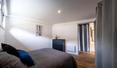 Un ou plusieurs lits dans un hébergement de l'établissement Appartement lumineux à 600m de la plage