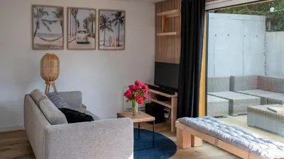 Coin salon dans l'établissement Appartement lumineux à 600m de la plage