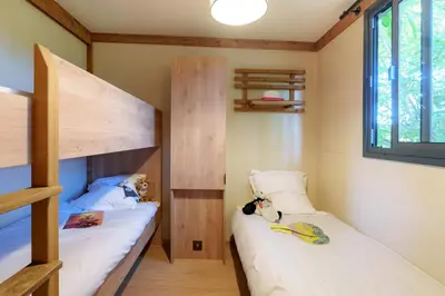 Un ou plusieurs lits dans un hébergement de l'établissement Camping de Lochrist