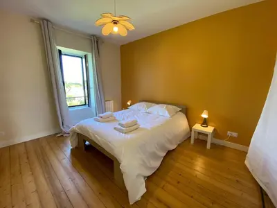 Un ou plusieurs lits dans un hébergement de l'établissement Villa Locquenole Sea View